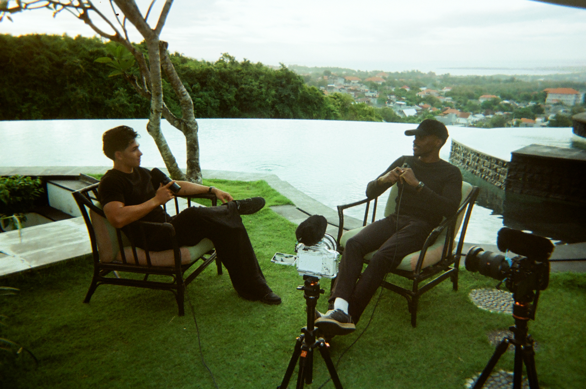 Members recording a conversation by the pool